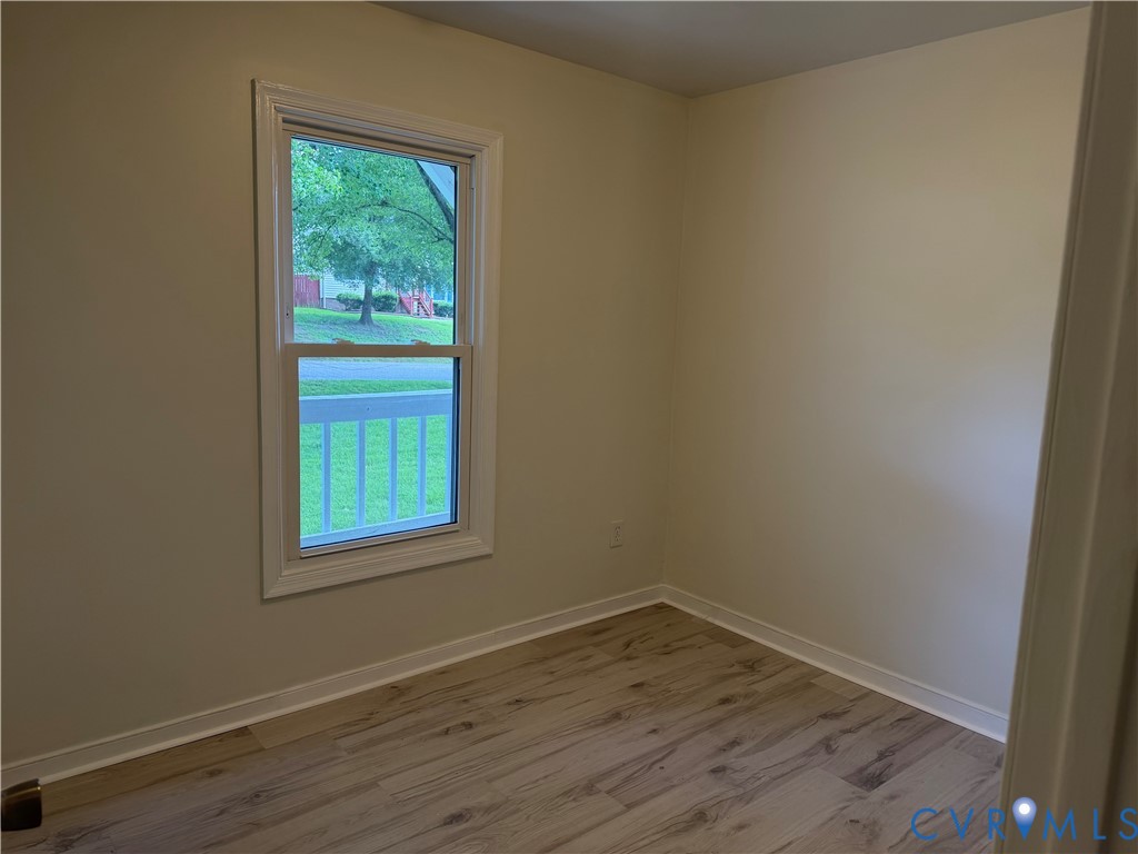 Light-toned walls with wood-finish flooring