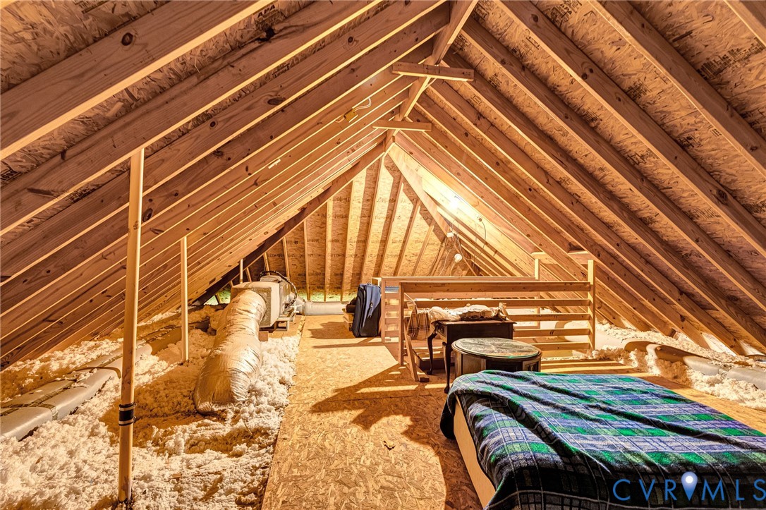Exposed wood framing, insulation, and ductwork