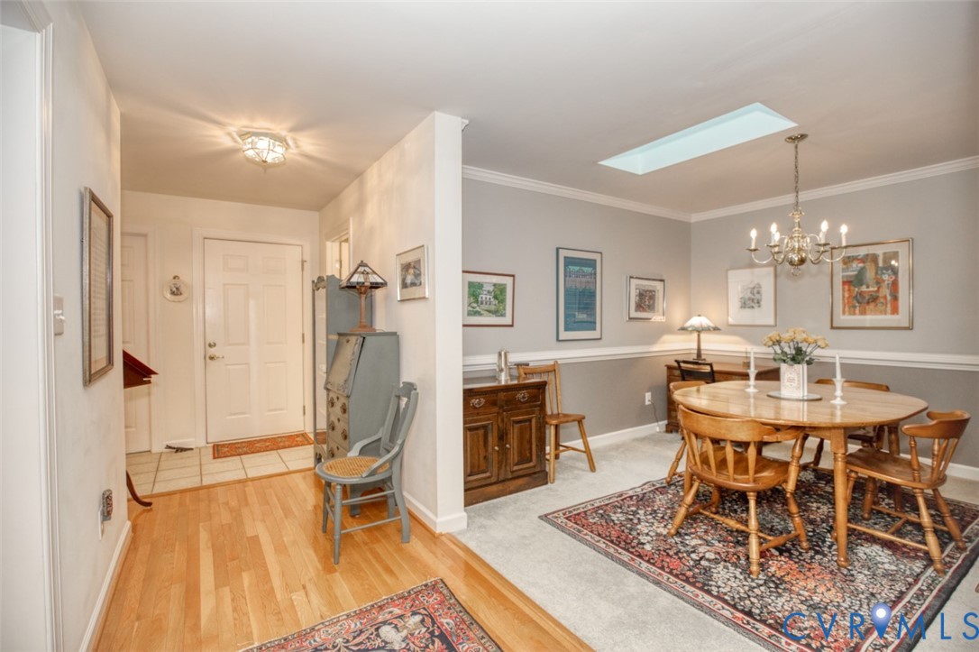 Warm wood flooring in the entryway