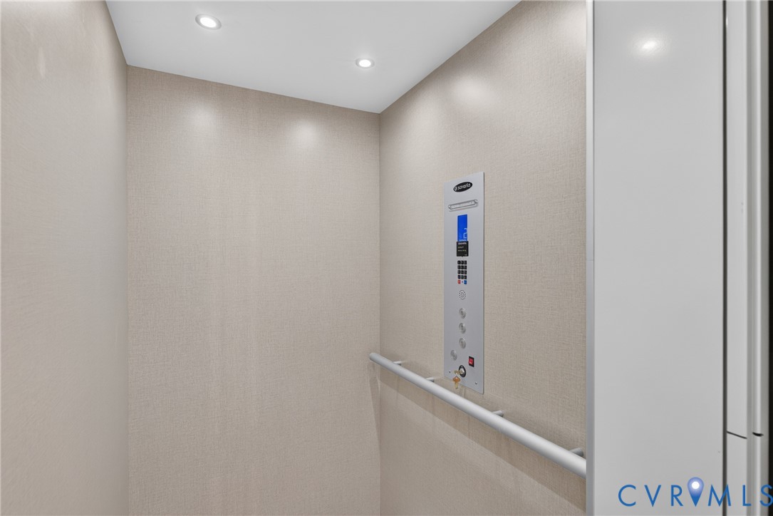 Recessed ceiling lighting, textured wall coverings, built-in control panel, and safety rail