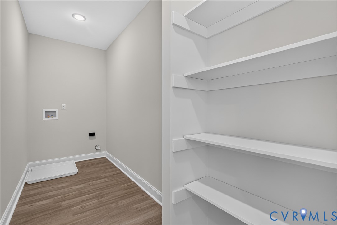Recessed ceiling lighting, wood-finish flooring, and built-in shelving