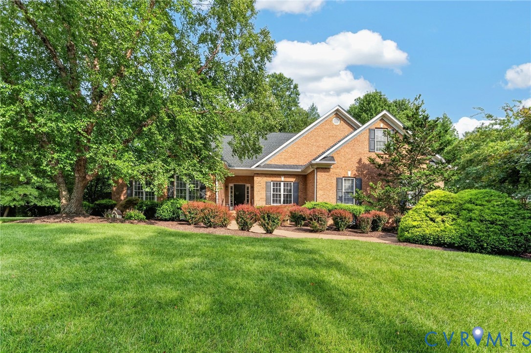 Brick Colonial residence set on expansive manicured grounds with mature landscaping Brick Colonial residence set on expansive manicured grounds with mature landscaping