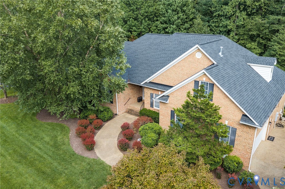 Brick exterior with dark shingle roofing Brick exterior with dark shingle roofing