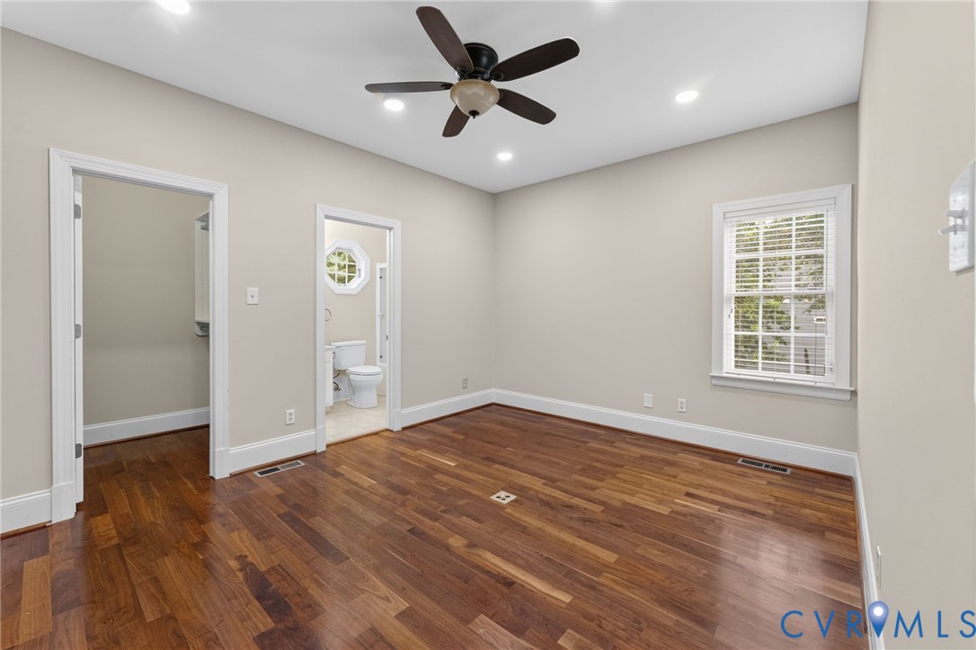 Hardwood flooring, recessed lighting, ceiling fan, and a window with blinds
