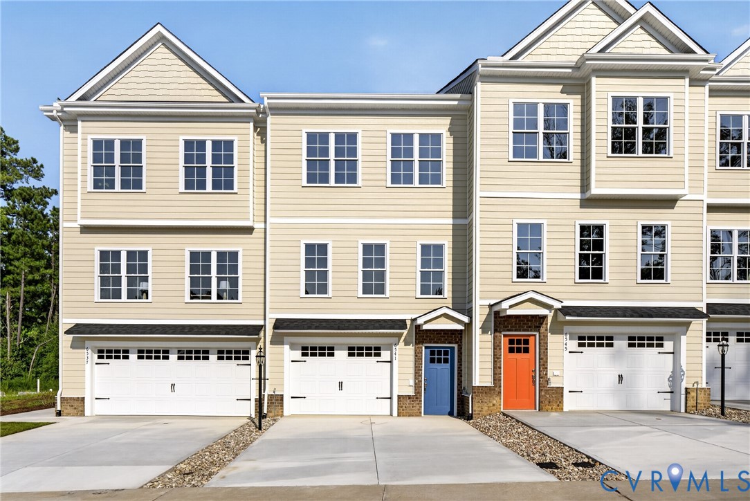Cream-toned siding exterior with multiple window configurations Cream-toned siding exterior with multiple window configurations