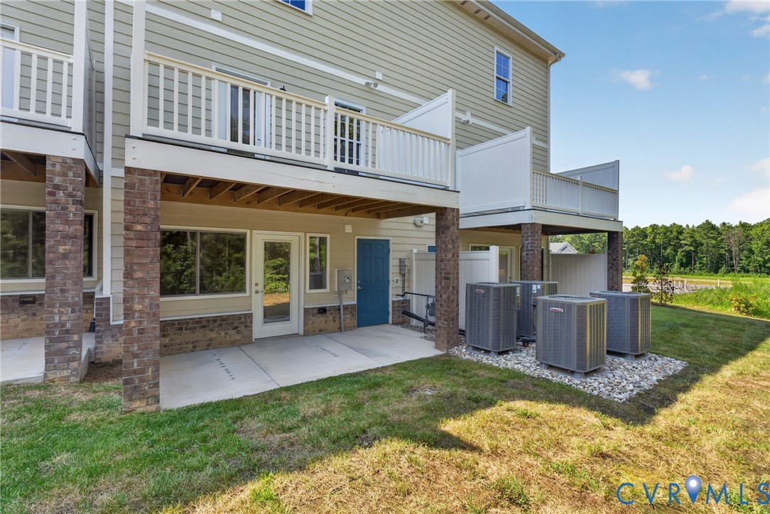 Exterior siding in a neutral tone with white trim