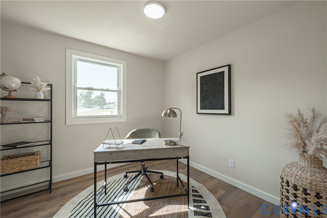 Recessed ceiling light, single window, wood-finish flooring, light-toned walls, and white trim