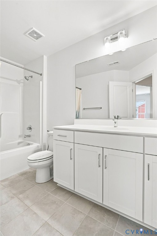 White shaker-style vanity with a light-toned countertop, integrated sink, and brushed nickel hardware