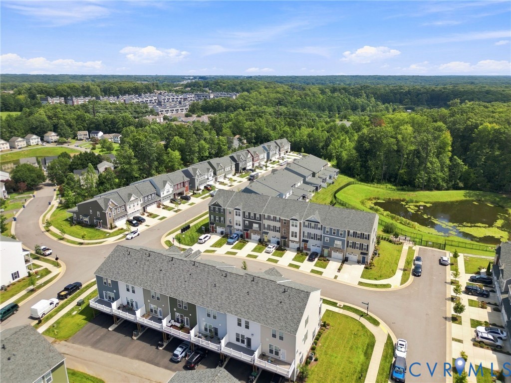 Residential development featuring townhomes with attached garages and varied facades