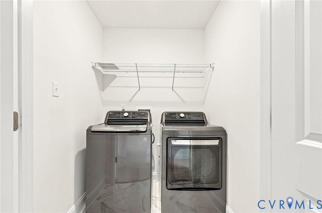 Dedicated laundry area with a wire storage shelf