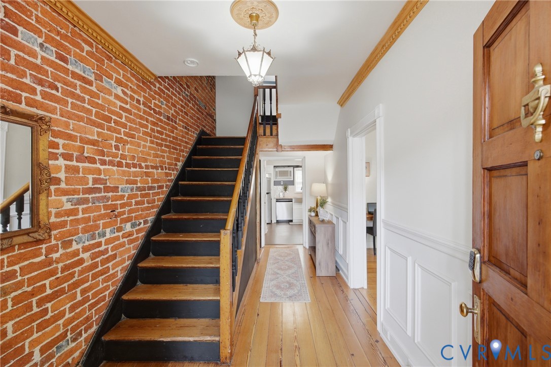 Exposed brick, wood floors, wood stairway Exposed brick, wood floors, wood stairway