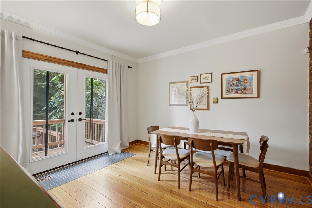Hardwood floors, french doors to deck and backyard, exposed brick