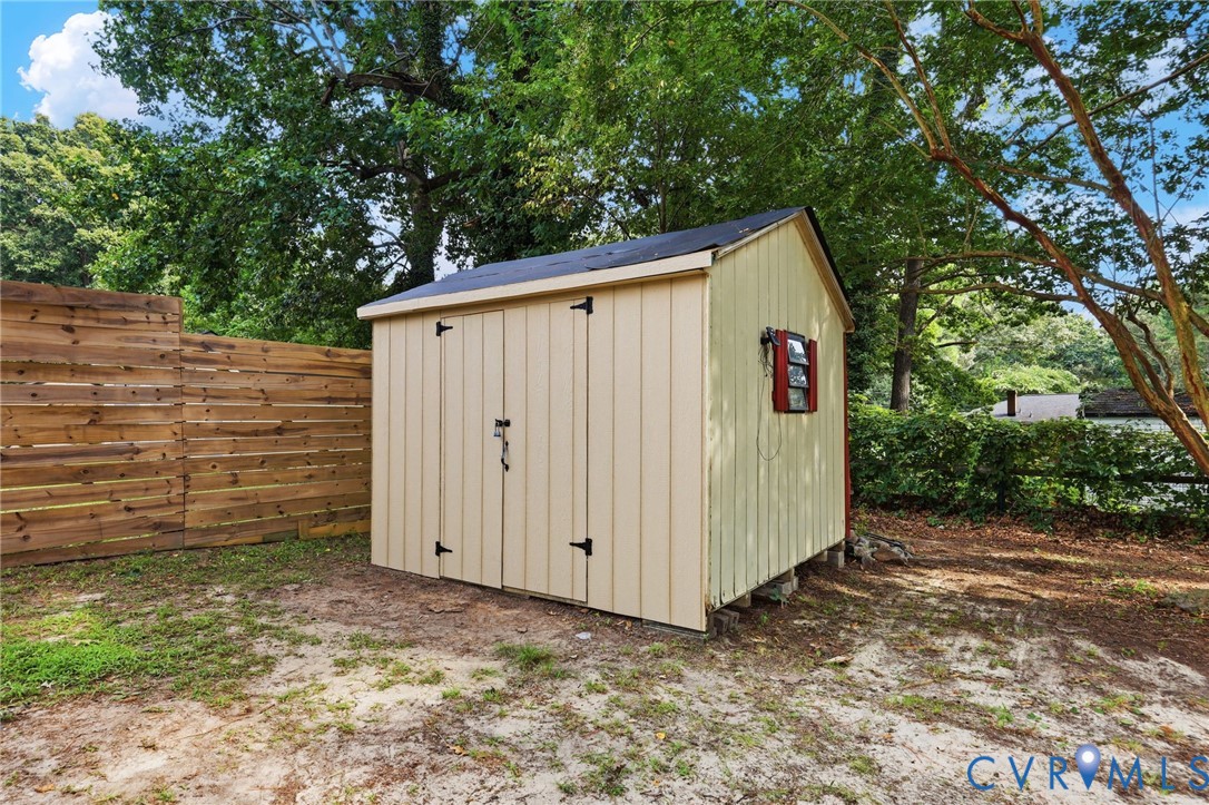 Detached storage shed with a gabled roof and board-and-batten siding