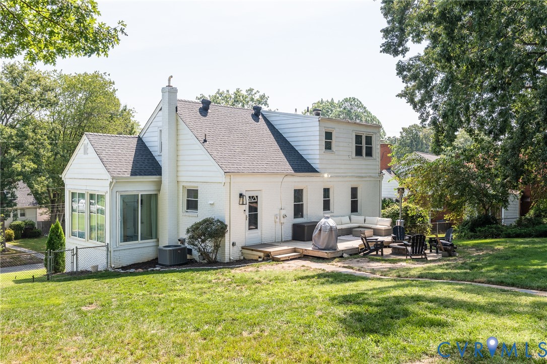 Expansive rear deck and patio with multi-level design