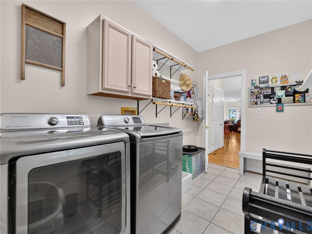 1st Floor Laundry Room with tile floor - dog washing station is on other side of washer! Washer & Dryer convey!