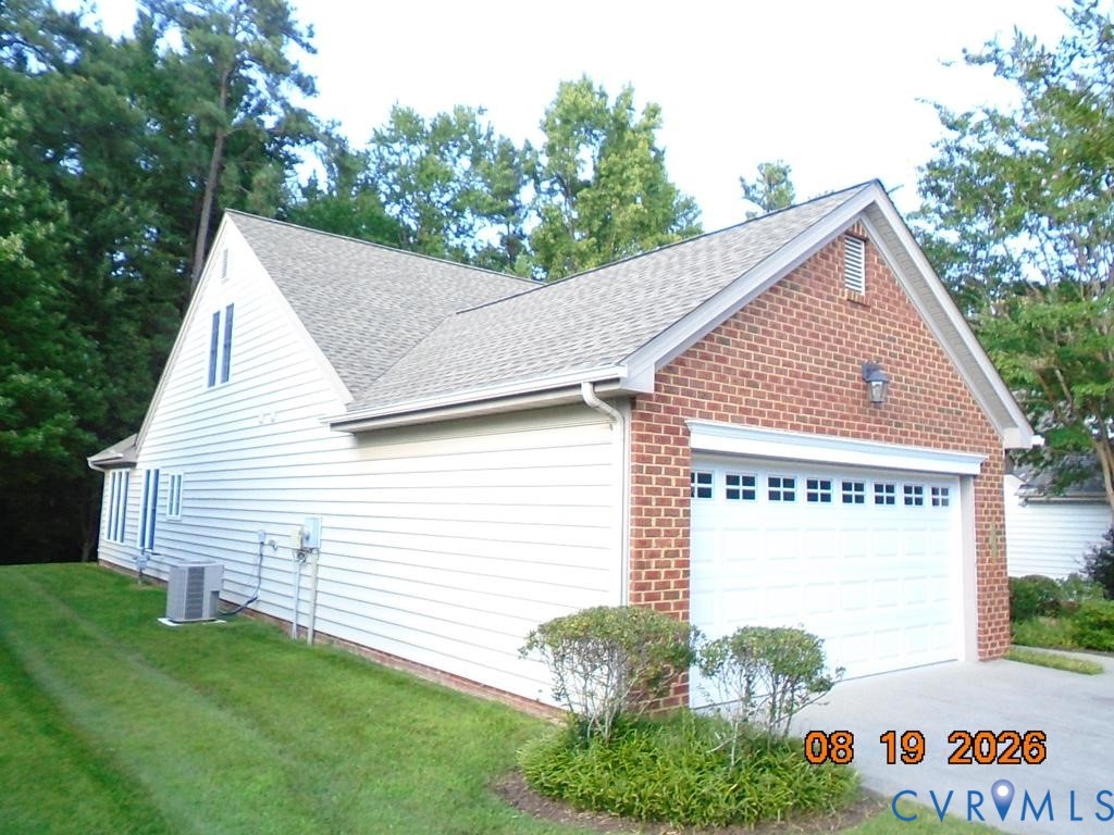 Brick and siding exterior with an attached two-car garage Brick and siding exterior with an attached two-car garage