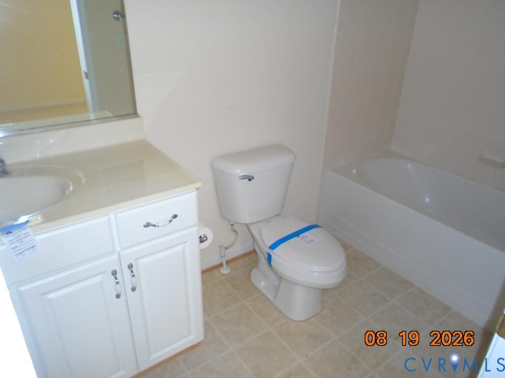 White vanity with an integrated sink and mirror