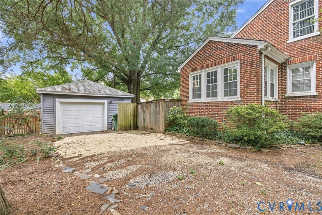 Double car garage with tin roof.