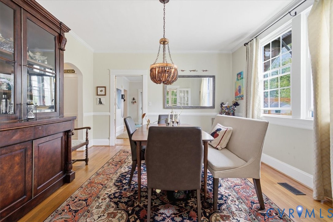 Wood-finish flooring, crown molding, and wainscoting details Wood-finish flooring, crown molding, and wainscoting details