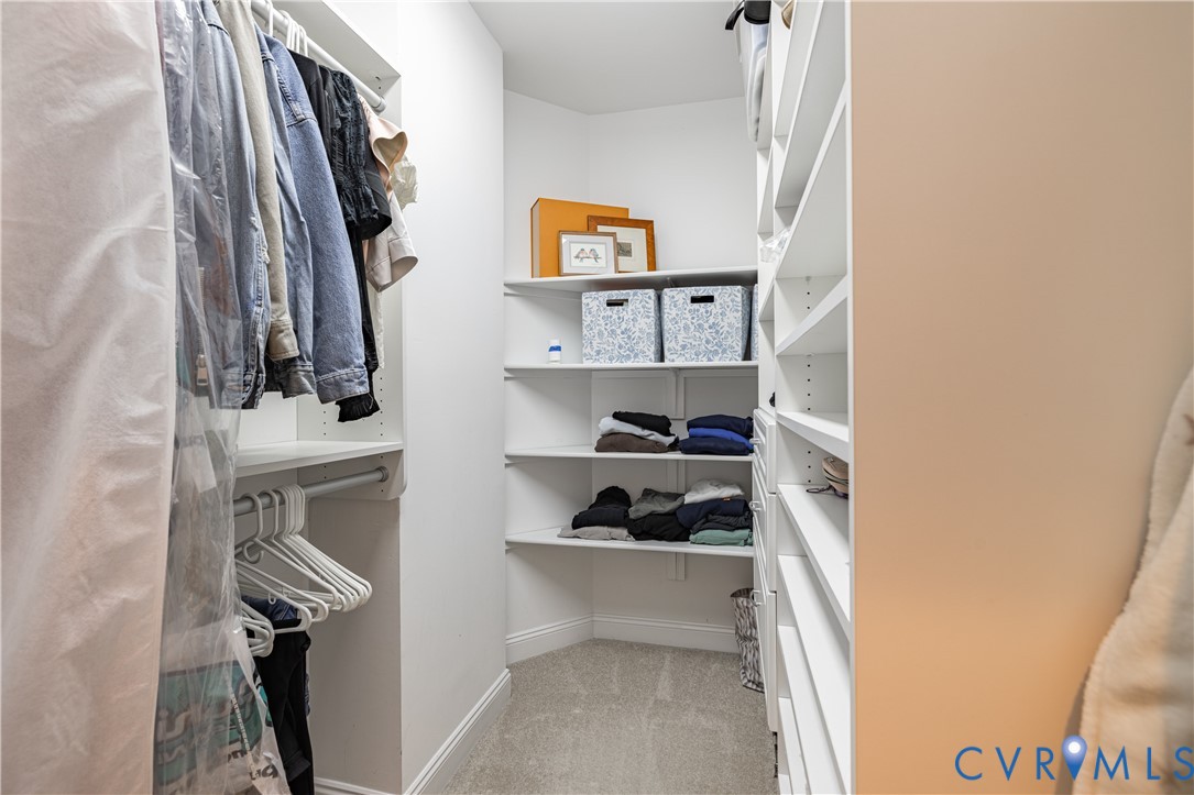 Walk-in closet featuring built-in shelving
