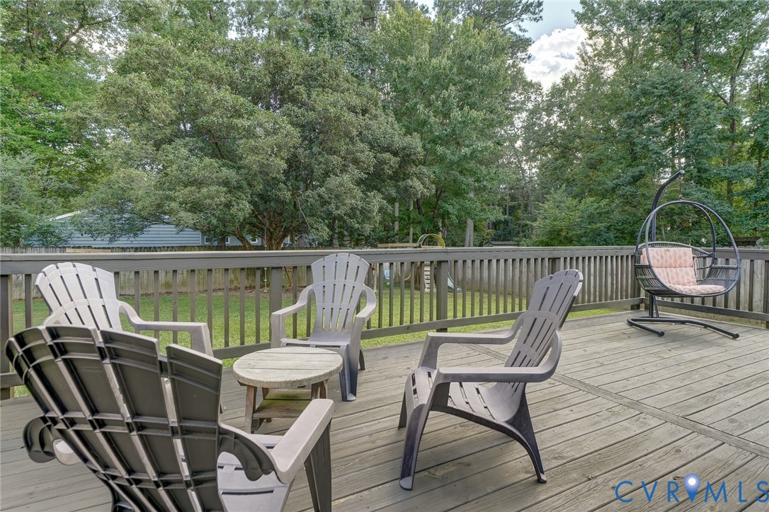Expansive outdoor deck with wood flooring and a perimeter railing