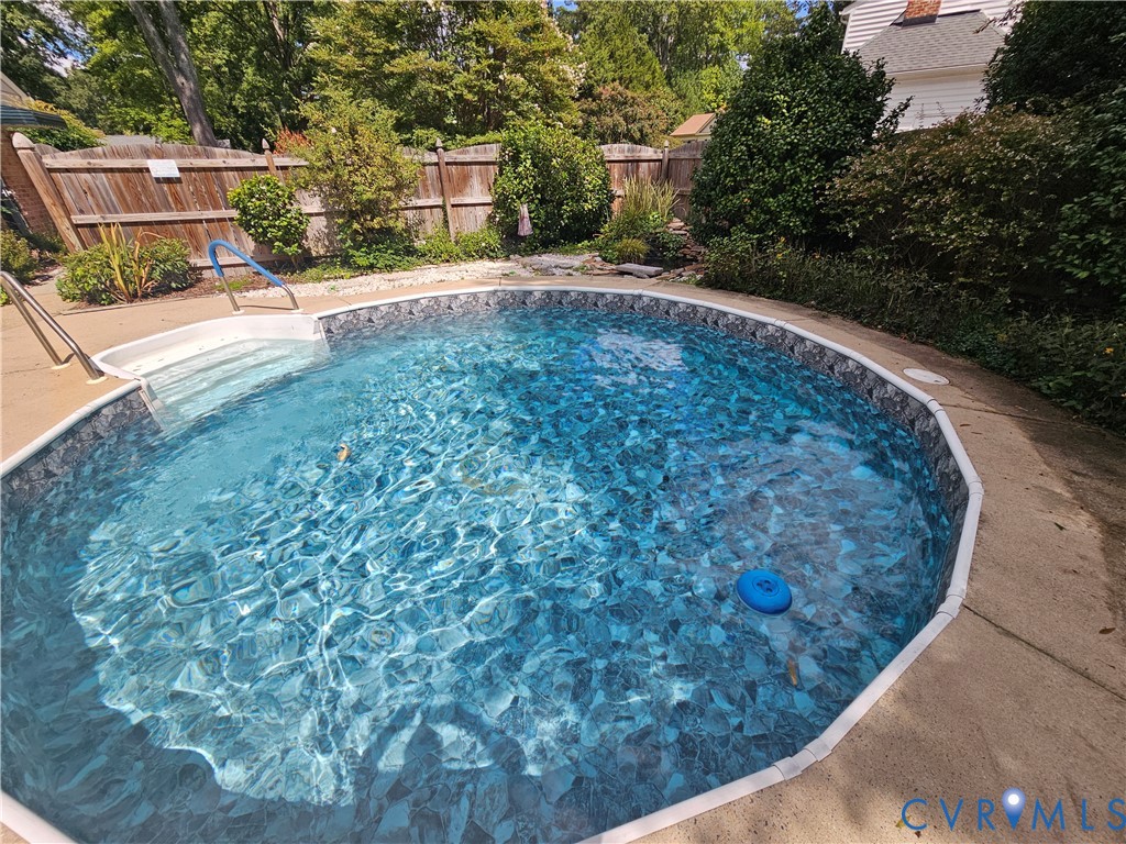 In-ground pool featuring integrated steps and perimeter coping In-ground pool featuring integrated steps and perimeter coping