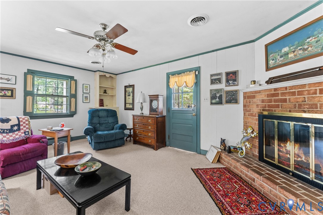 Brick fireplace with a metal and glass enclosure