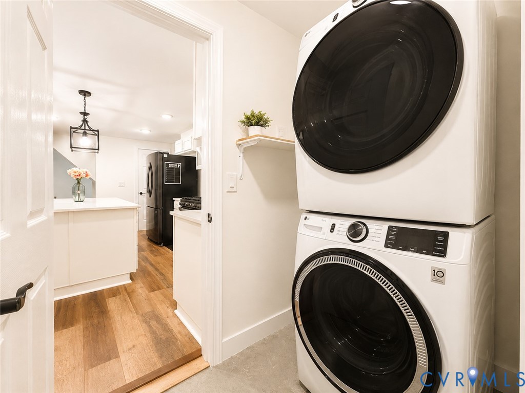 Laundry area with stacked washer and dryer unit