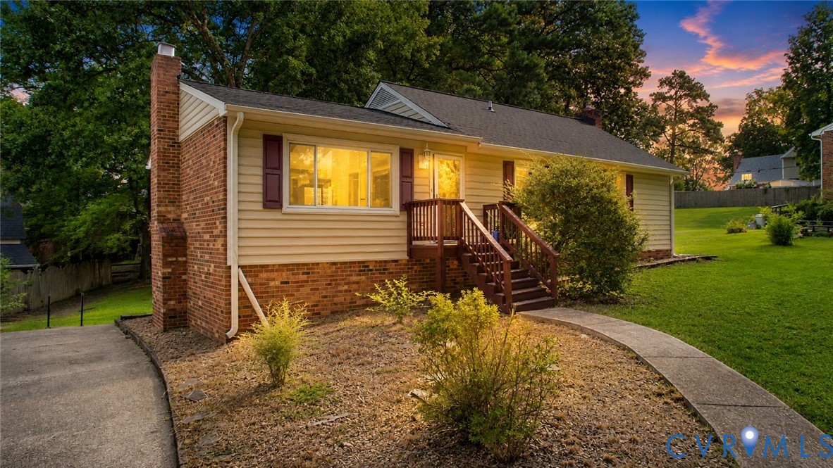 Brick and siding exterior with a prominent brick chimney