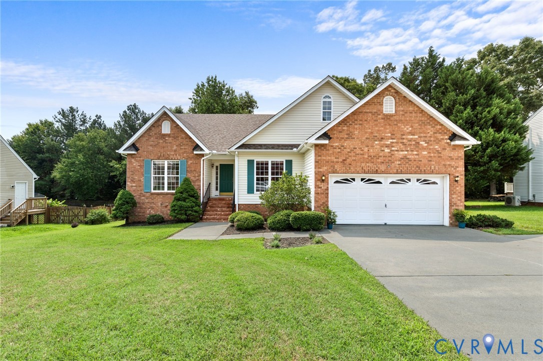 Brick and siding exterior with a two-car garage