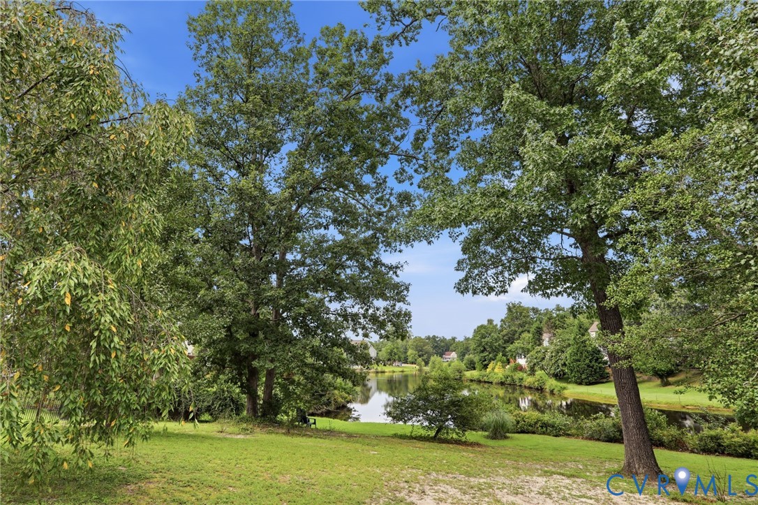 Serene waterfront backdrop offers beautiful views and a peaceful natural setting just beyond the backyard.