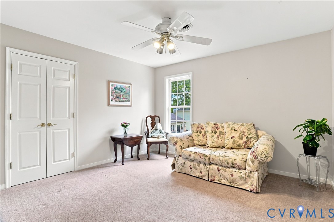 Spacious third bedroom features neutral finishes, ample closet space, and natural light.