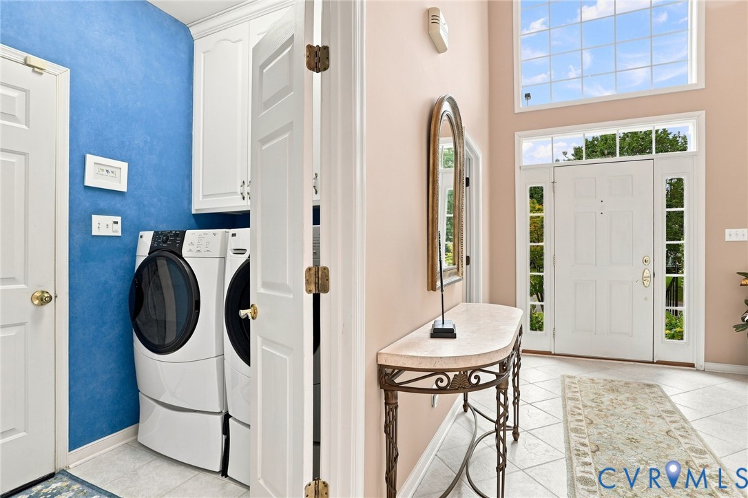 Two-story foyer features abundant natural light with a conveniently located first-floor laundry room off the garage.