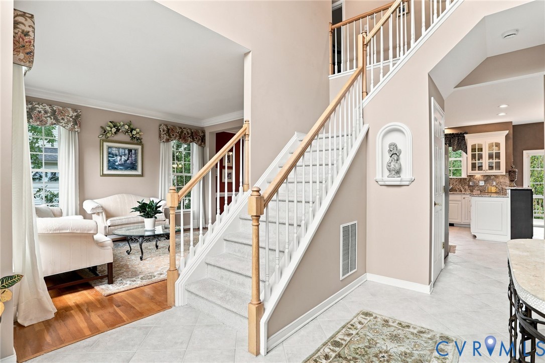 Bright two-story foyer welcomes you inside with an open staircase with brand new carpet and easy flow into the main living spaces.