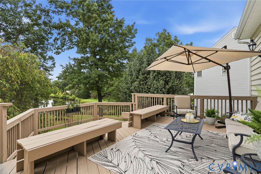 Expansive rear deck provides plenty of space for outdoor dining, entertaining, and relaxing while overlooking the water