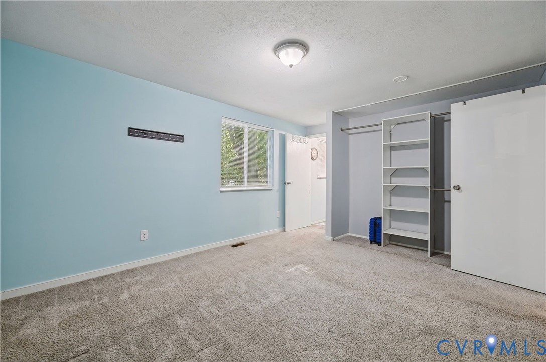 Wall-to-wall carpeting and neutral wall tones