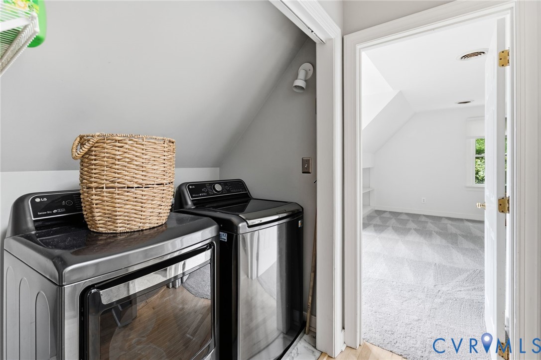 Dedicated laundry area with built-in shelving