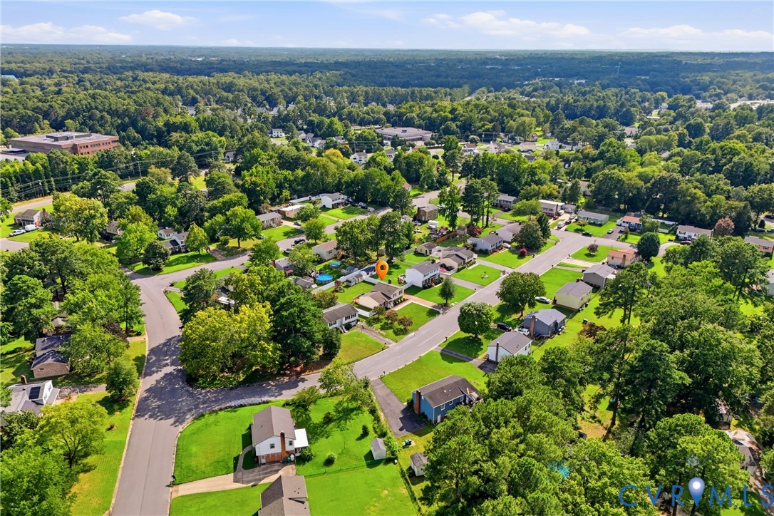 Residential neighborhood with mature trees and paved streets