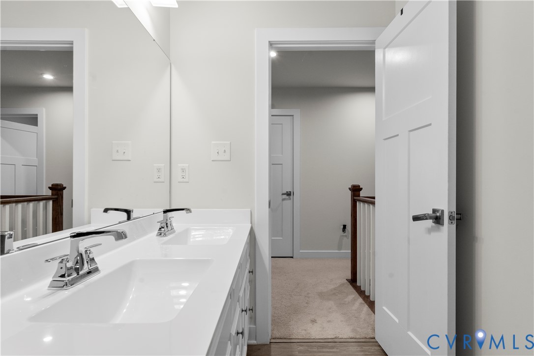 Dual vanity with integrated sinks and chrome fixtures
