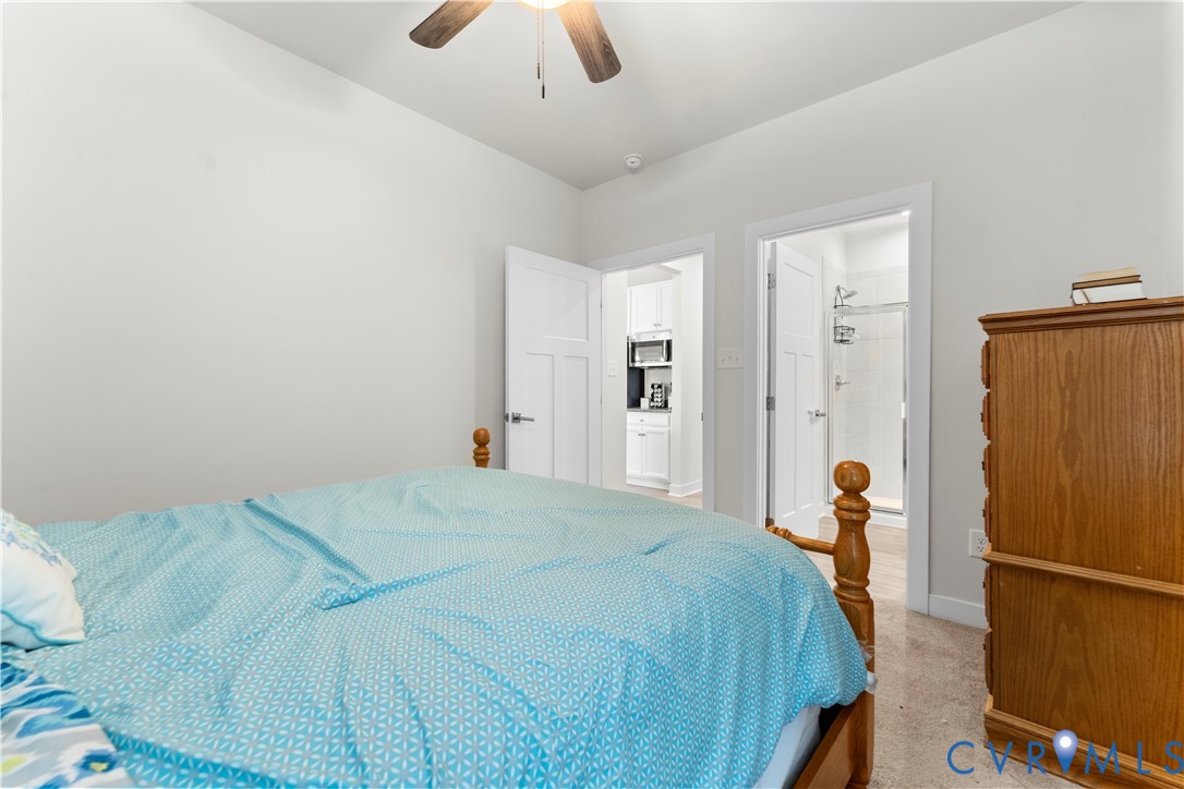 Recessed lighting with a ceiling fan, white wall paint, and light-toned flooring