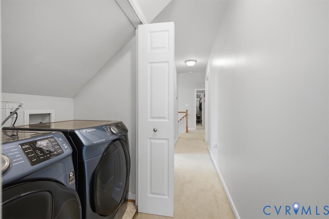 Side by side washer dryer in hallway that convey