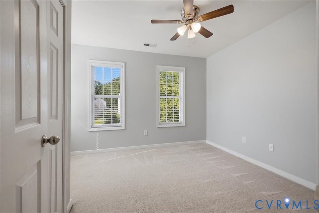 Bedroom 3 with ceiling fan, great natural light