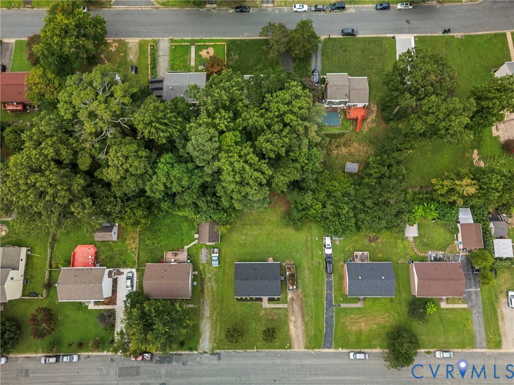 Aerial perspective showcasing a residential street with multiple properties