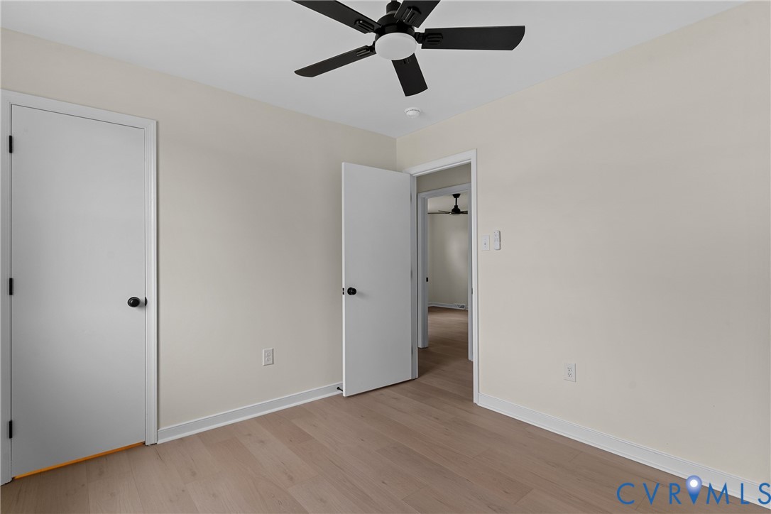 Light wood-finish flooring complemented by neutral wall tones