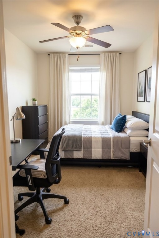 Wall-to-wall carpeting with a central window, recessed lighting, and a ceiling fan with integrated lighting