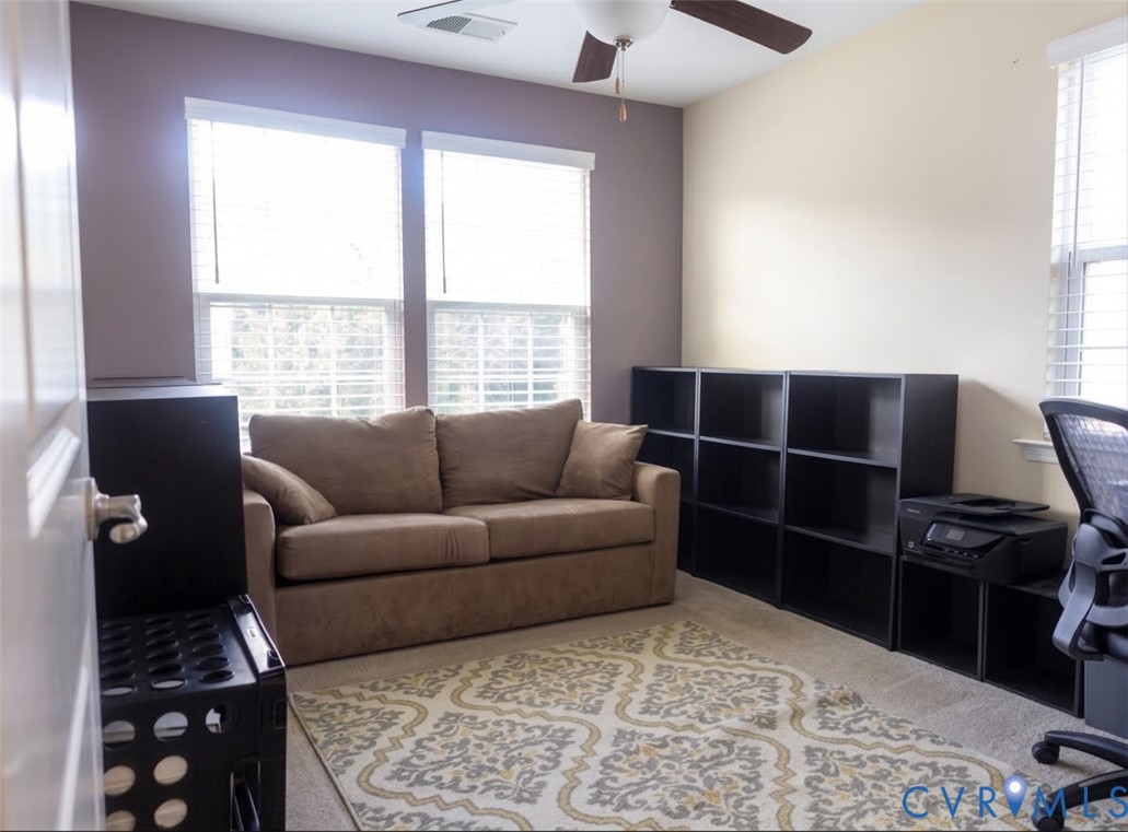 Vaulted ceiling with a ceiling fan