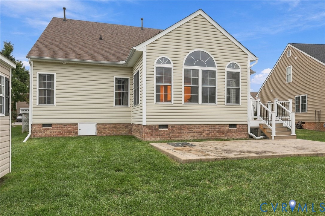 Light-colored siding exterior with a shingled roof