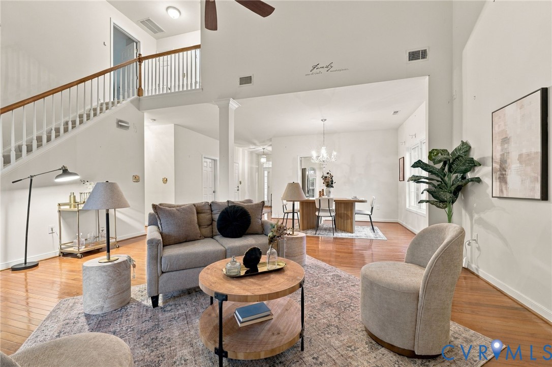 Hardwood flooring, vaulted ceilings, and an open-concept layout
