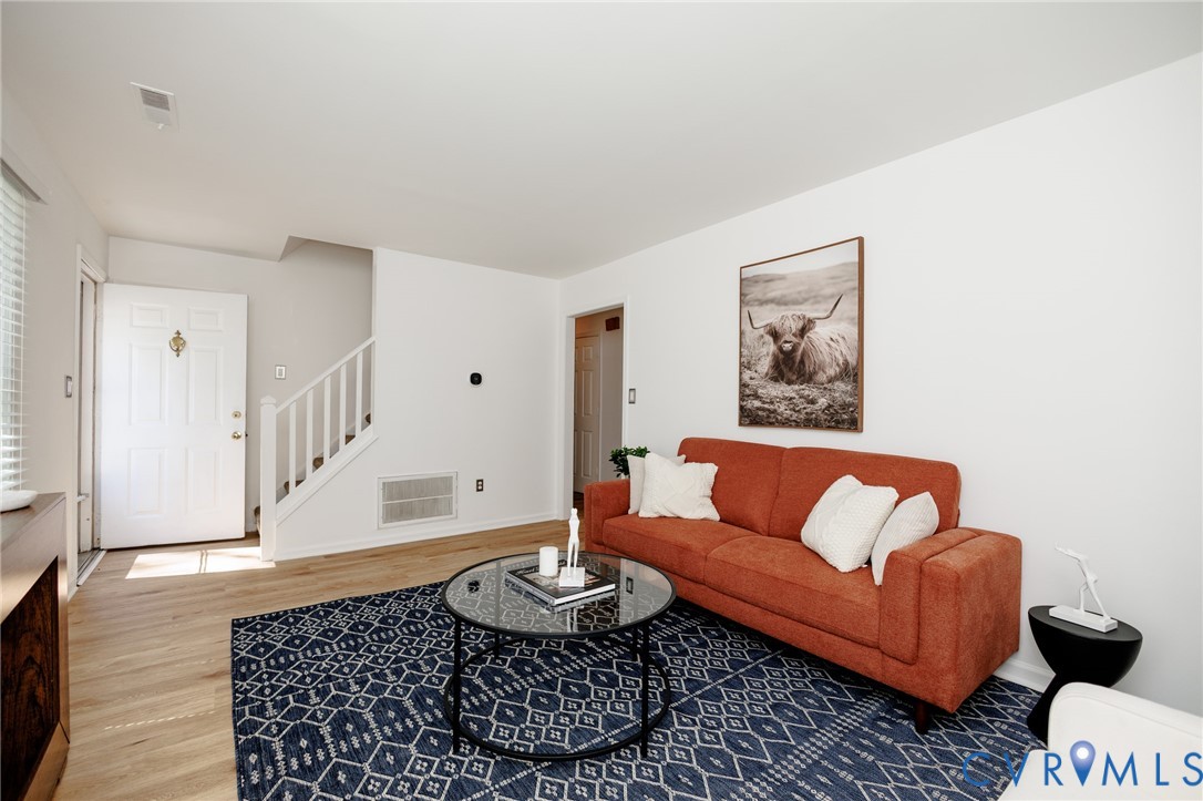 Light wood-finish flooring throughout the living space