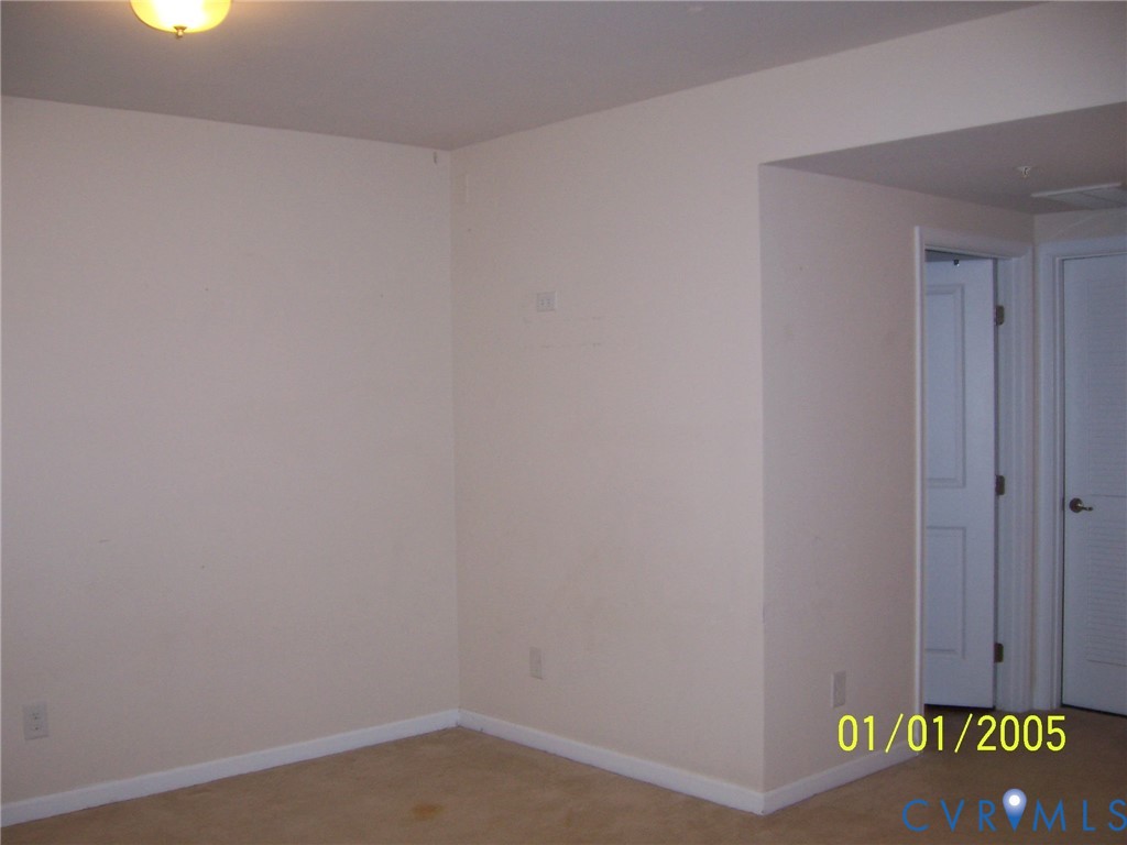 Unfurnished room featuring baseboards and light carpet Unfurnished room featuring baseboards and light carpet